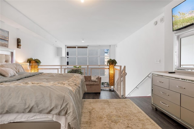 bedroom featuring dark hardwood / wood-style flooring