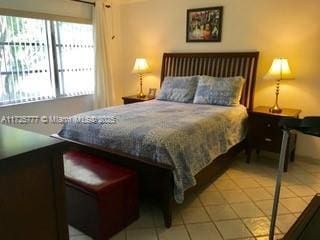 bedroom featuring multiple windows