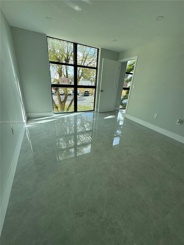 empty room with floor to ceiling windows