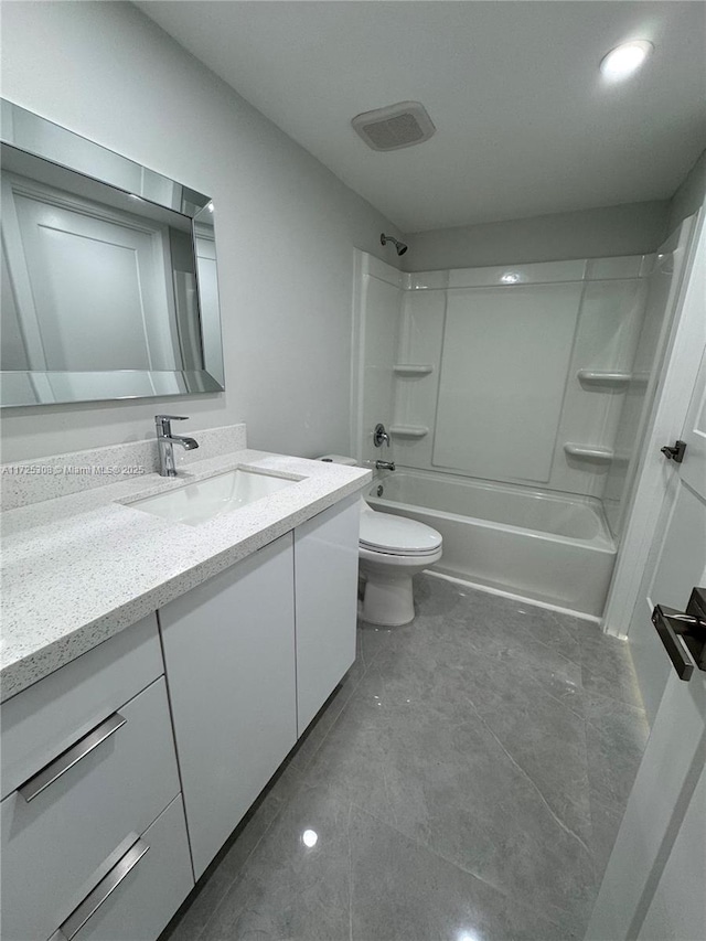 full bathroom featuring tile patterned floors, shower / washtub combination, toilet, and vanity