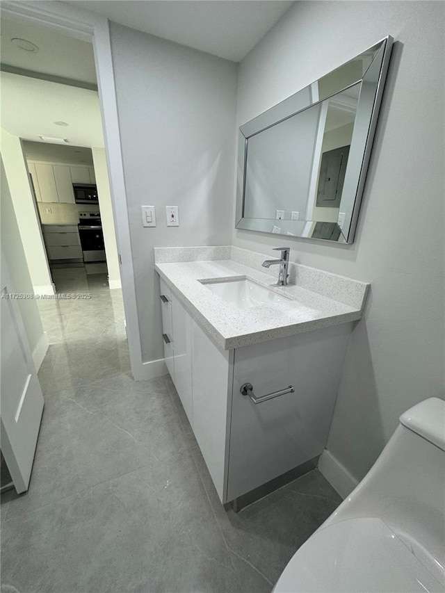 bathroom with vanity and toilet