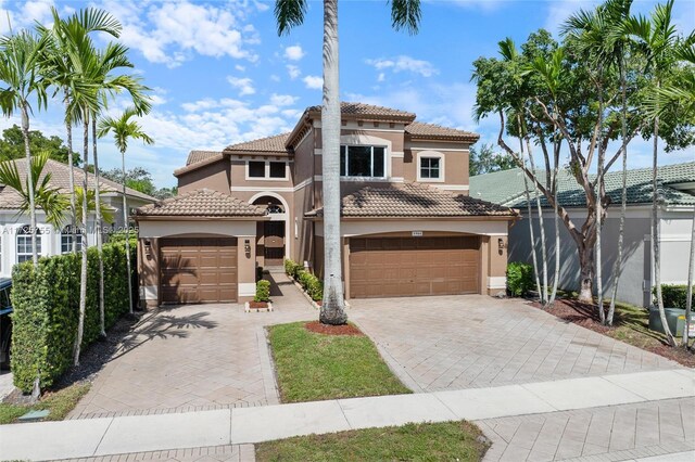 mediterranean / spanish-style home featuring a garage