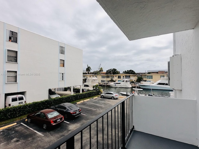 balcony featuring a water view