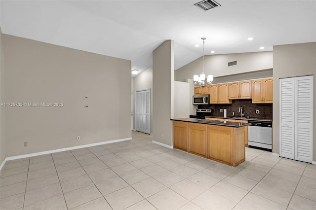 kitchen with appliances with stainless steel finishes, decorative light fixtures, light tile patterned flooring, and decorative backsplash