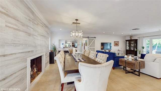 dining area featuring visible vents, ornamental molding, recessed lighting, a barn door, and light tile patterned floors