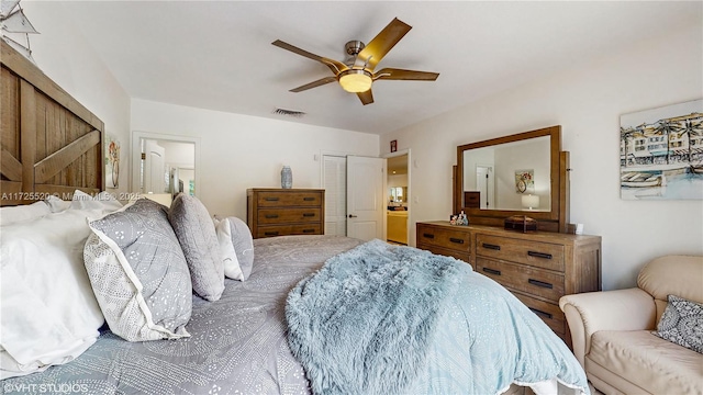 bedroom with a closet, visible vents, connected bathroom, and a ceiling fan