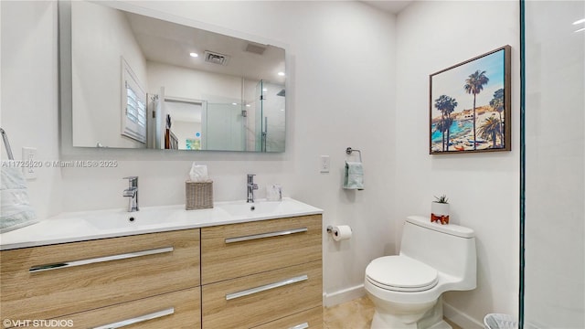 full bath with visible vents, double vanity, a sink, a shower stall, and toilet