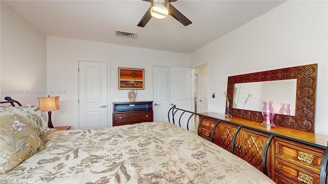 bedroom featuring visible vents and ceiling fan