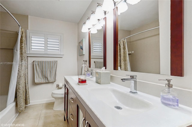 full bathroom featuring tile patterned flooring, toilet, vanity, and baseboards