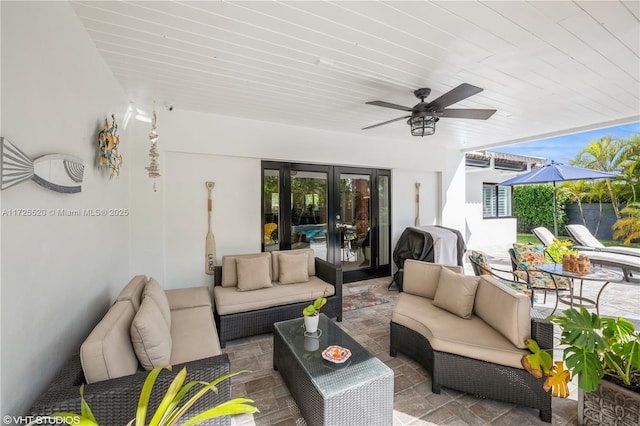 view of patio / terrace featuring grilling area, an outdoor hangout area, and a ceiling fan