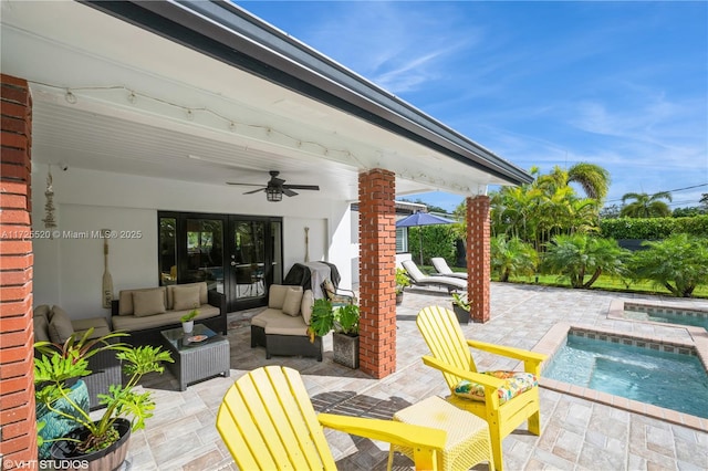 view of patio / terrace with an outdoor pool, an outdoor hangout area, an in ground hot tub, and ceiling fan