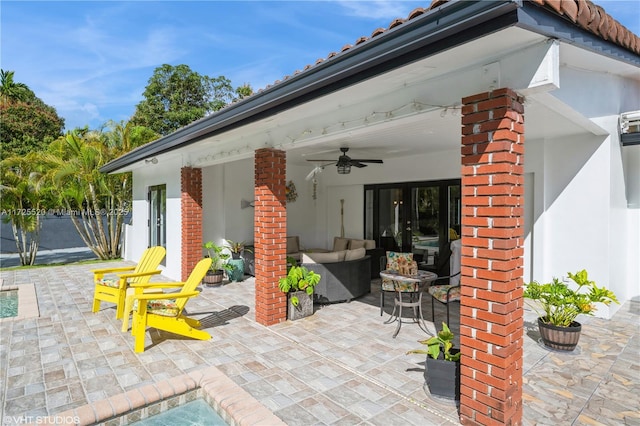 view of patio featuring an outdoor living space and ceiling fan