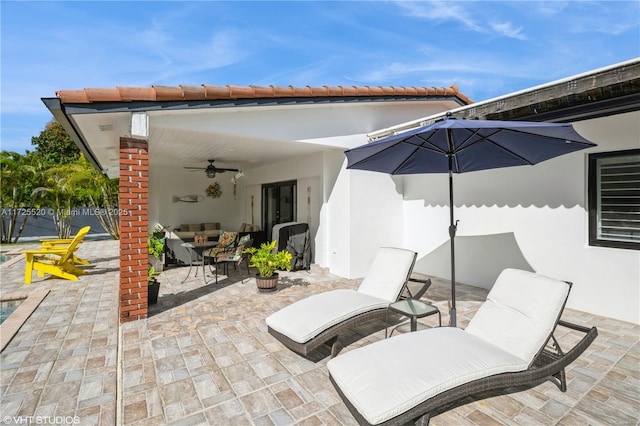 view of patio featuring a ceiling fan