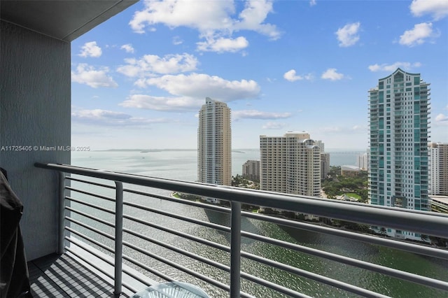 balcony featuring a water view