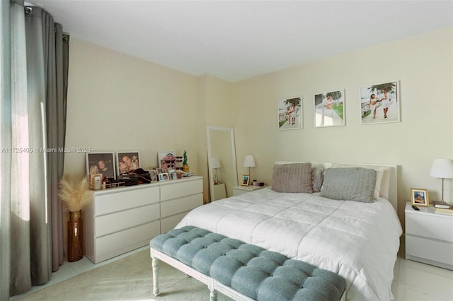 bedroom with light tile patterned floors