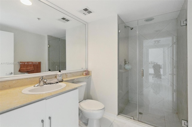 bathroom with a shower with door, tile patterned flooring, vanity, and toilet