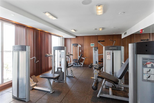 gym featuring wooden walls