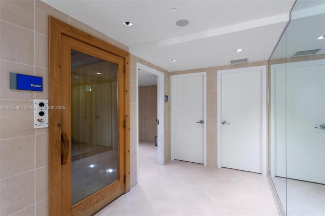 bathroom featuring tile walls