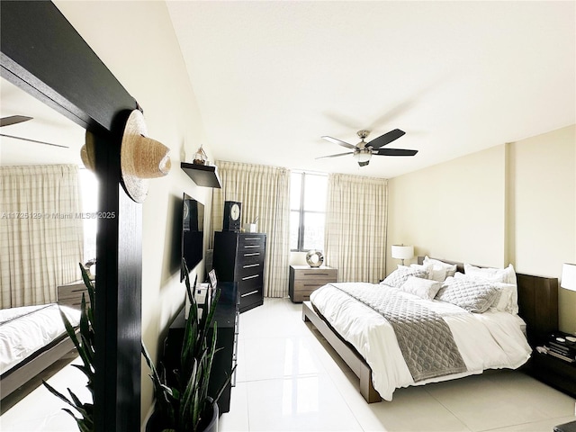 bedroom with light tile patterned flooring and a ceiling fan