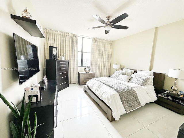 bedroom featuring ceiling fan and light tile patterned flooring