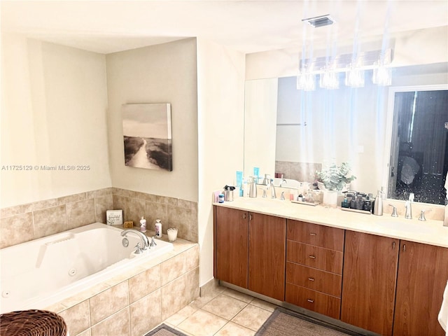 bathroom featuring a whirlpool tub, double vanity, tile patterned flooring, and visible vents