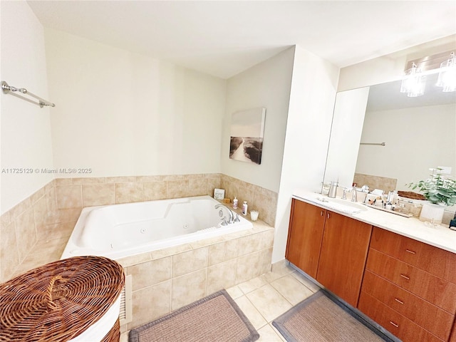 bathroom featuring a whirlpool tub, tile patterned flooring, and vanity