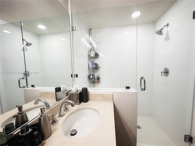 bathroom featuring a stall shower and vanity