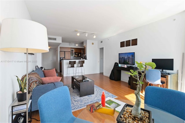 living room with hardwood / wood-style floors