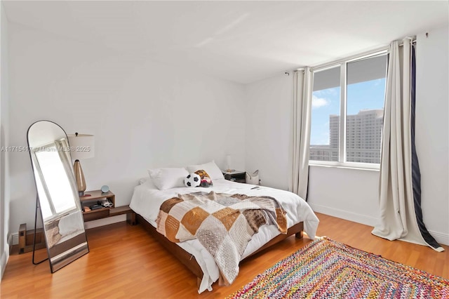 bedroom with wood-type flooring