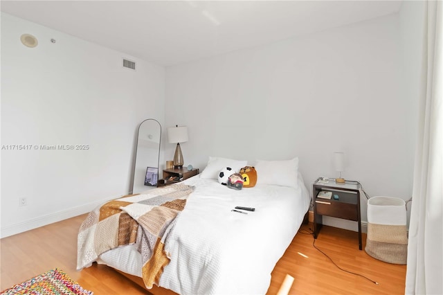 bedroom featuring hardwood / wood-style floors