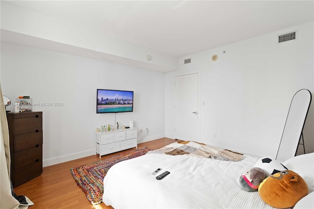 bedroom with light hardwood / wood-style flooring