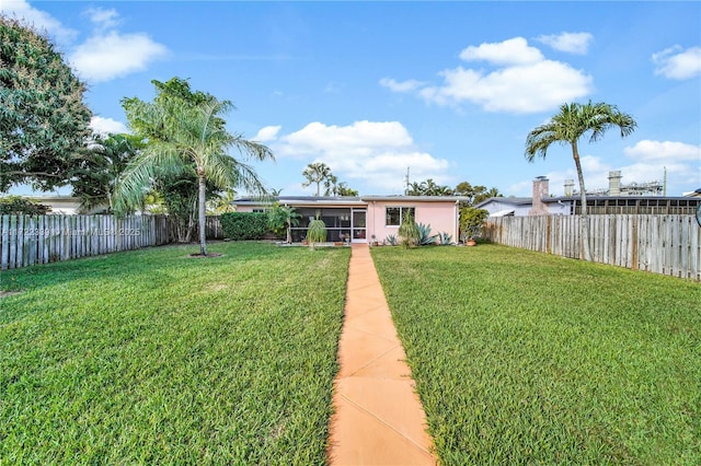 view of yard featuring a sunroom