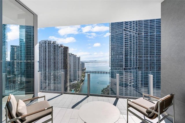 balcony featuring a water view