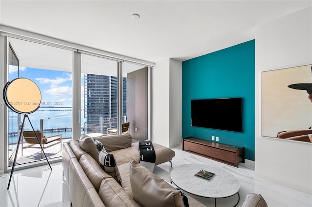 living room featuring a healthy amount of sunlight and expansive windows