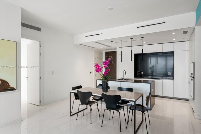 300 Biscayne Blvd Way Unit 2505, Miami, FL 33131 - dining room featuring baseboards and recessed lighting