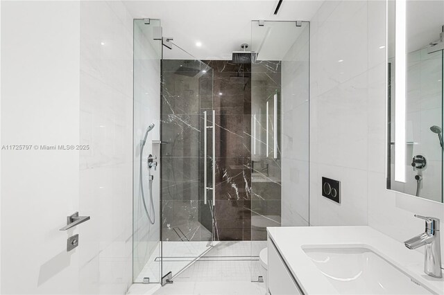300 Biscayne Blvd Way Unit 2505, Miami, FL 33131 - full bath featuring vanity, a marble finish shower, tile walls, and toilet