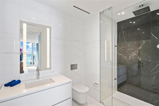 bathroom with tile walls, a tile shower, toilet, and vanity