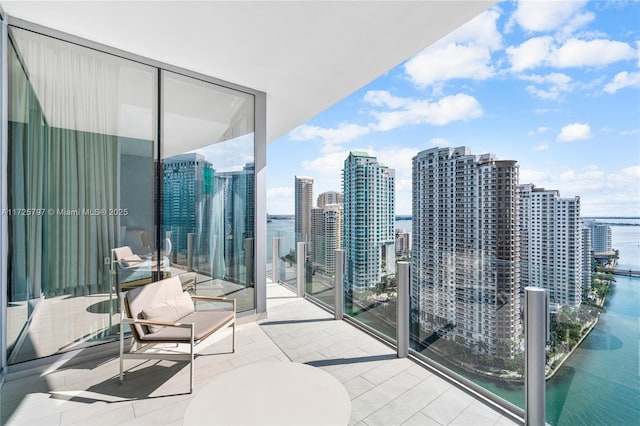 balcony featuring a water view