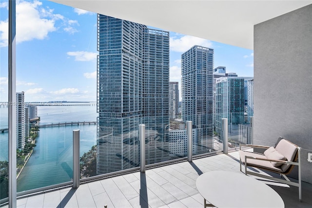 balcony featuring a water view