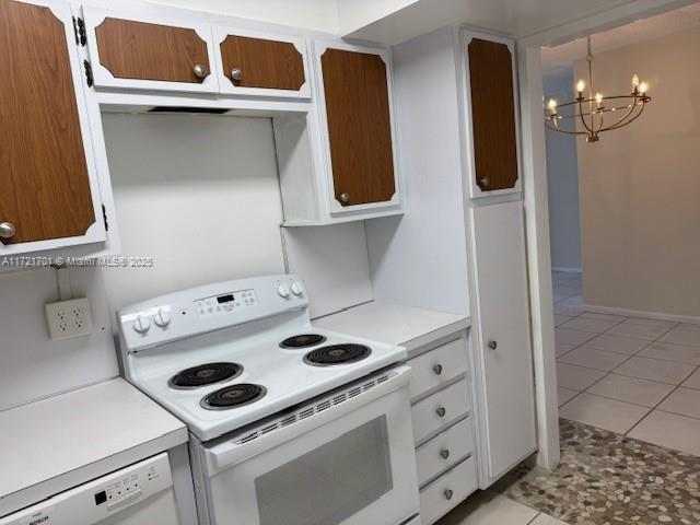 9381 E Bay Harbor Dr Unit 401N, Bay Harbor Islands, FL 33154 - kitchen featuring white appliances, a chandelier, light tile patterned floors, and light countertops