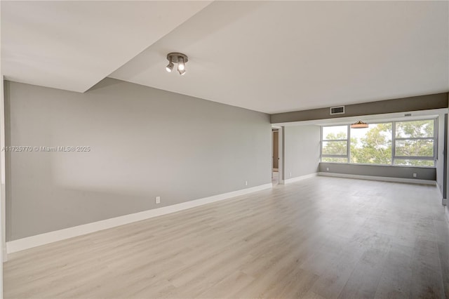 spare room with light wood-type flooring