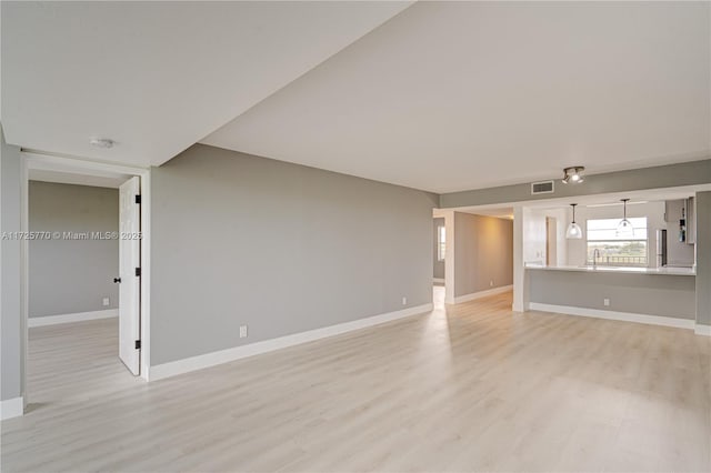 unfurnished living room with light hardwood / wood-style flooring