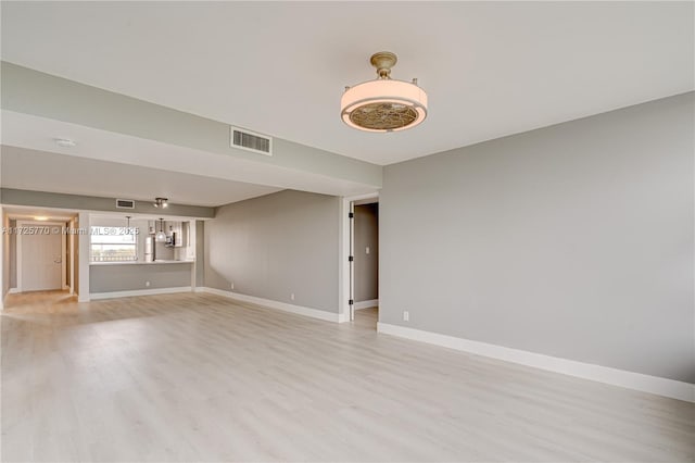 unfurnished living room featuring light wood-type flooring