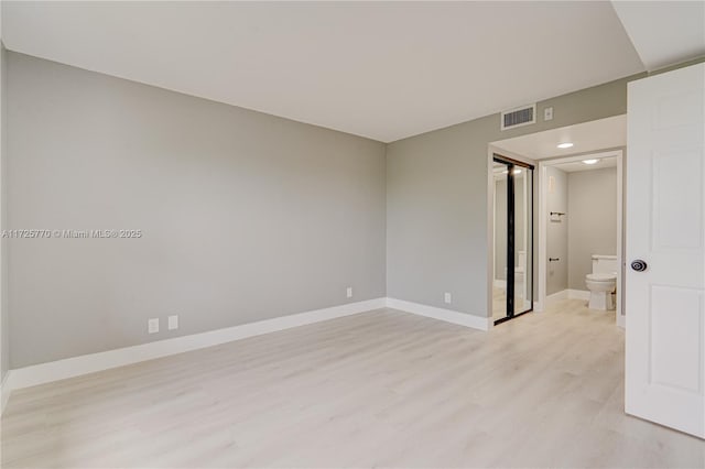 unfurnished room with light hardwood / wood-style floors