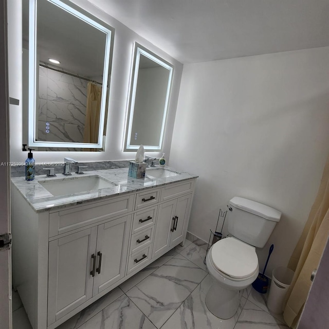 bathroom featuring toilet, vanity, and curtained shower