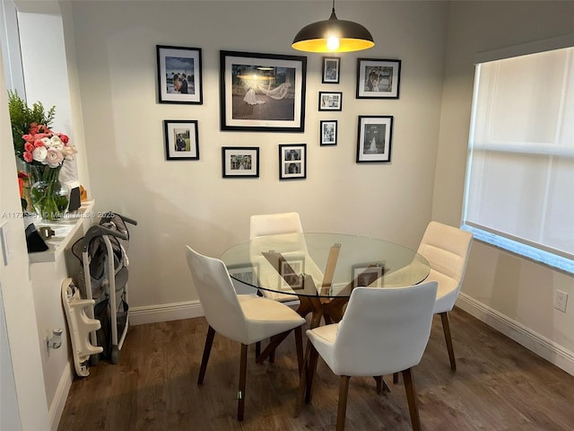 dining room with dark wood-type flooring