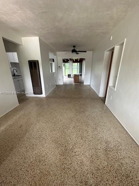 spare room with ceiling fan and sink