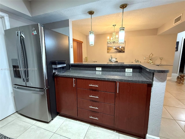 kitchen featuring a notable chandelier, stainless steel fridge with ice dispenser, light tile patterned flooring, and pendant lighting