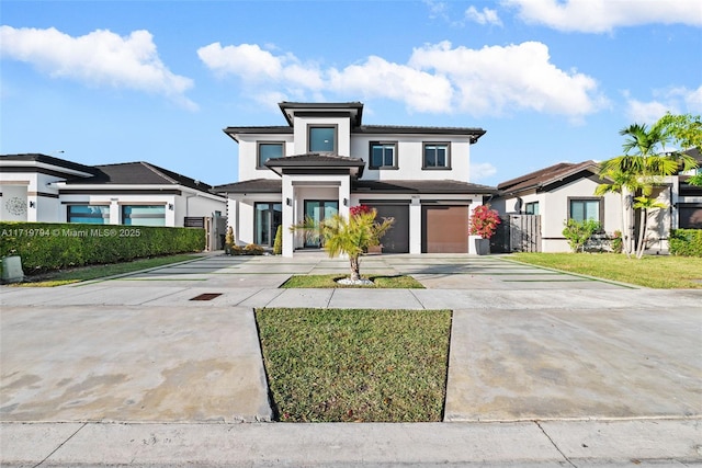 prairie-style home featuring a garage