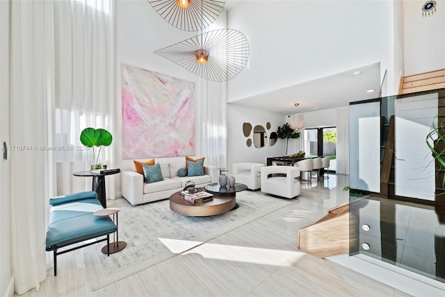 living room with a towering ceiling